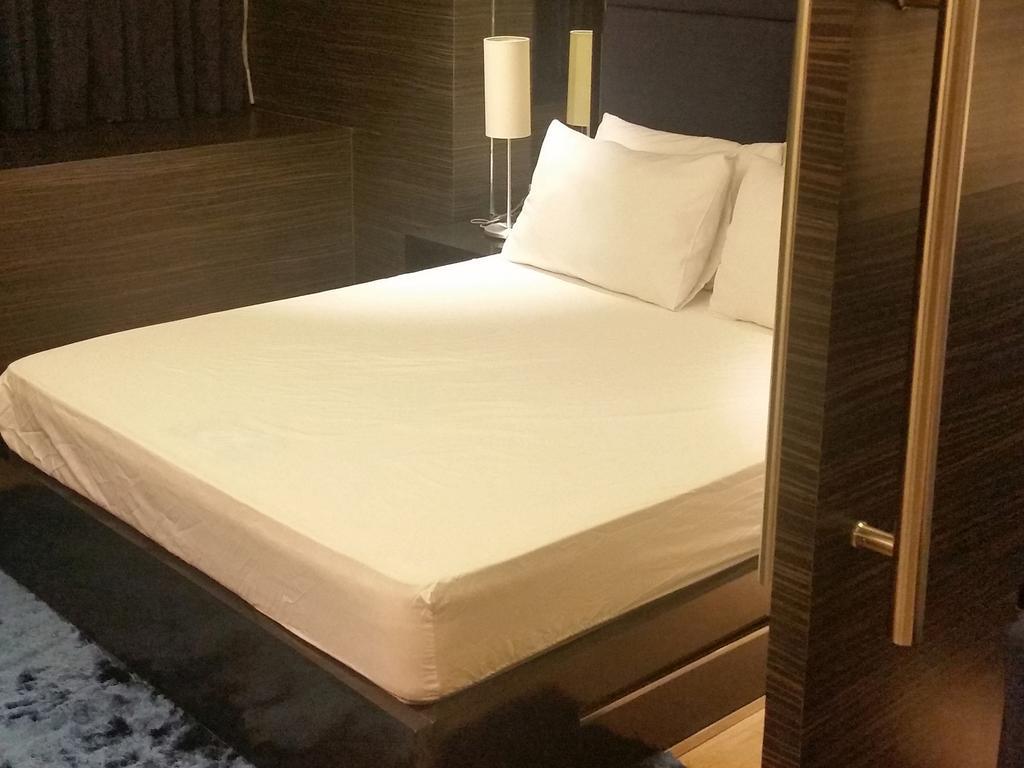 Shang Luxury Suites Mandaluyong Номер фото
