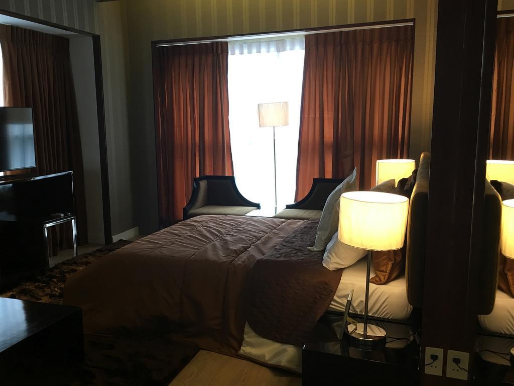 Shang Luxury Suites Mandaluyong Номер фото